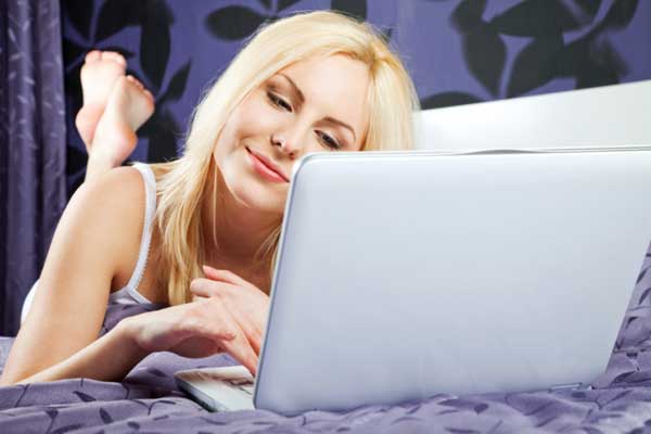 Woman using laptop online